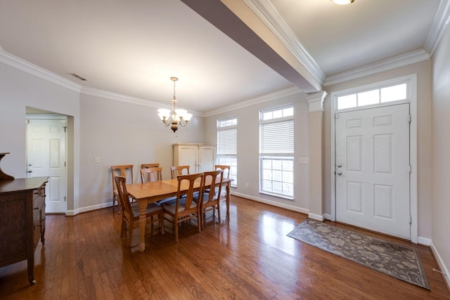 dining space with crown molding, visible vents, and dark wood-style flooring