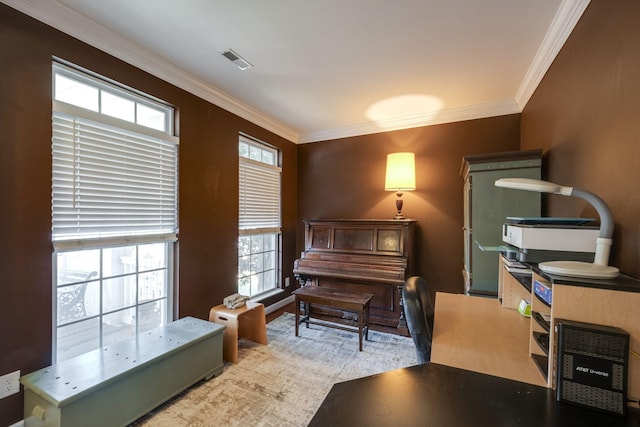 sitting room with visible vents and crown molding