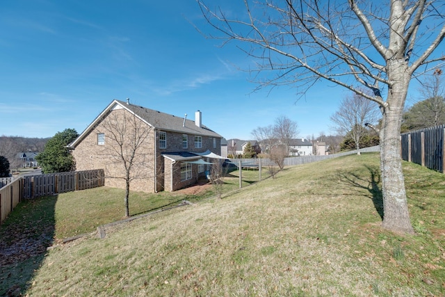 view of yard with a fenced backyard