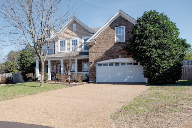 view of front of home with brick siding, a porch, concrete driveway, a garage, and a front lawn