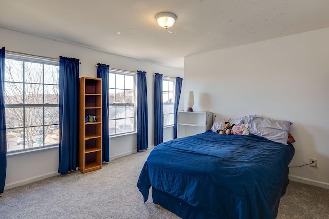 carpeted bedroom with baseboards