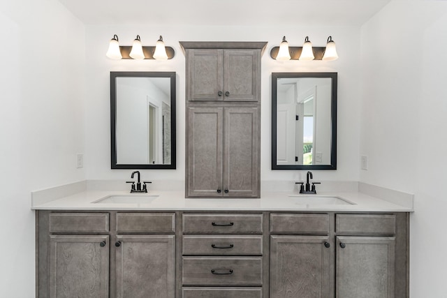 bathroom featuring double vanity and a sink