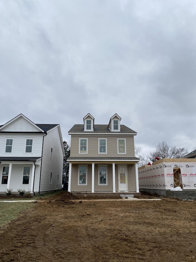 view of front of house featuring covered porch and board and batten siding