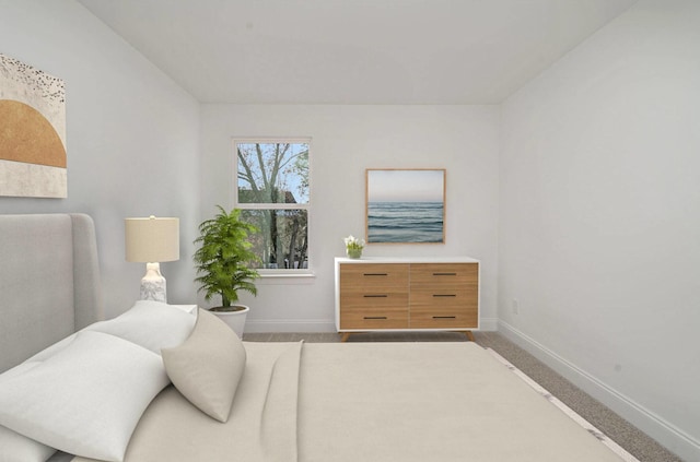 living area featuring baseboards and carpet flooring