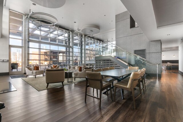 600 12th Ave S Unit 405, Nashville, TN 37203 - dining room featuring a towering ceiling, stairway, and wood finished floors