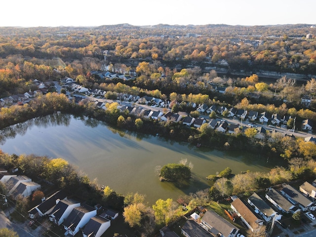 drone / aerial view featuring a residential view and a water view