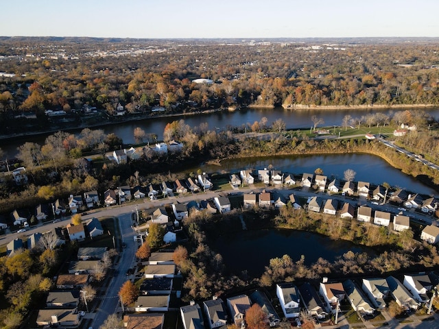 drone / aerial view with a water view and a residential view