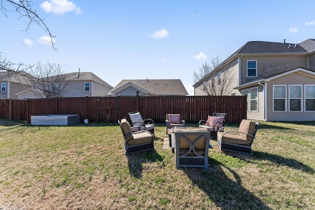 view of yard with fence and an outdoor living space