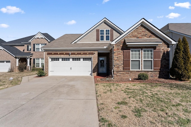 craftsman house with driveway, a front lawn, and stone siding