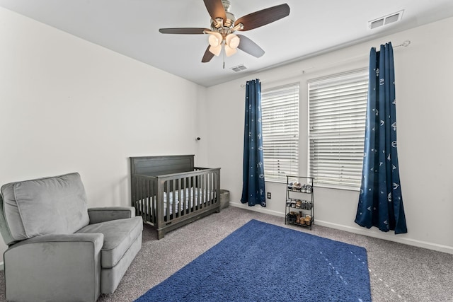 bedroom featuring carpet flooring, visible vents, and baseboards