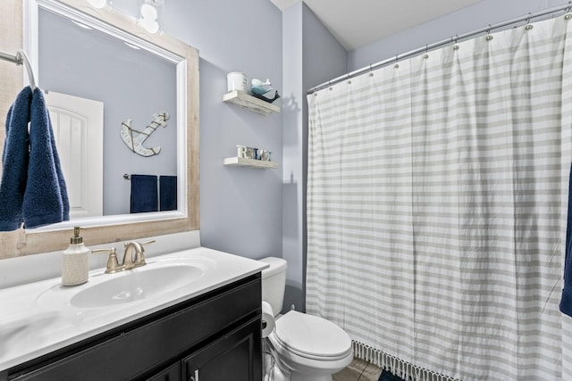 bathroom with a shower with shower curtain, vanity, and toilet