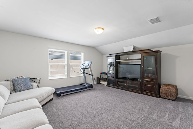 workout area with lofted ceiling, baseboards, visible vents, and carpet flooring