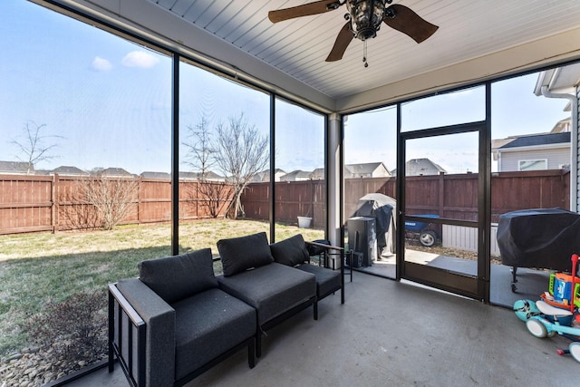 sunroom / solarium with ceiling fan