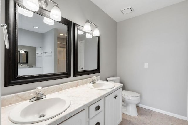 full bathroom featuring tile patterned flooring, a sink, toilet, and double vanity