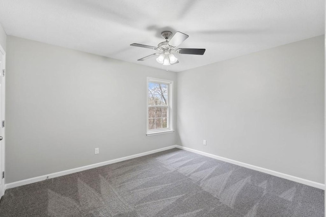 unfurnished room with carpet flooring, ceiling fan, and baseboards