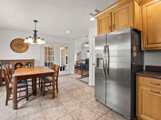 dining room featuring light tile patterned floors, recessed lighting, ceiling fan with notable chandelier, visible vents, and french doors