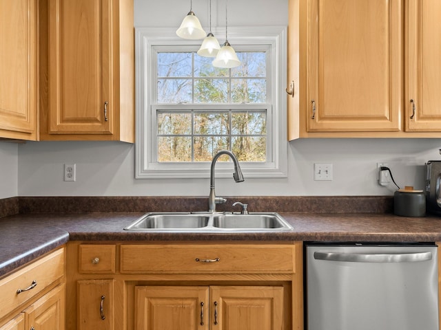 kitchen with dishwasher, hanging light fixtures, dark countertops, and a sink