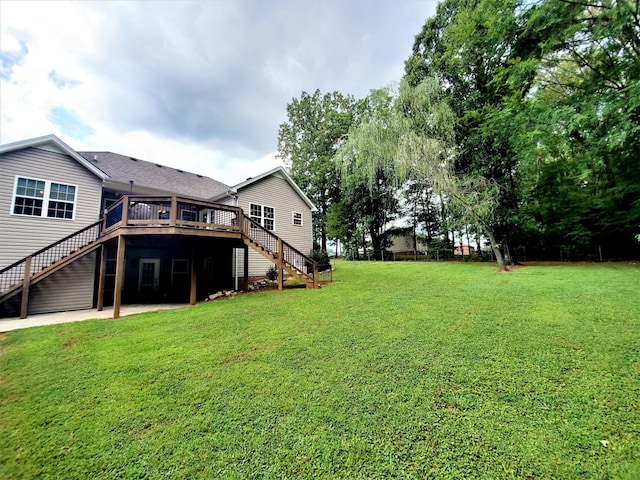 view of yard featuring a wooden deck and stairs