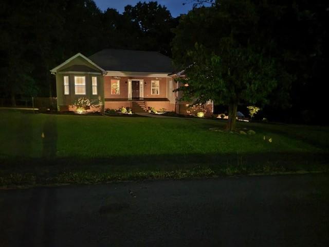 view of front of property with a yard