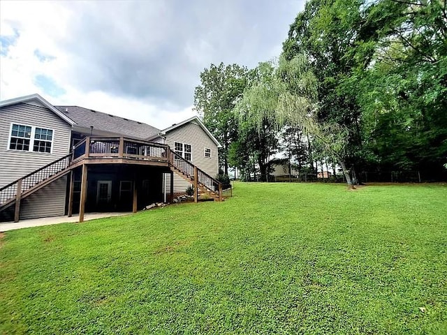 view of yard with stairway and a wooden deck