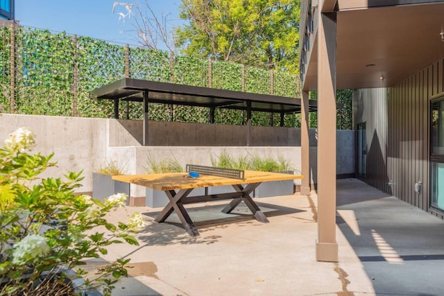 view of patio / terrace featuring fence