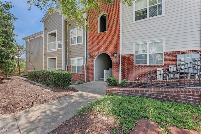 exterior space featuring brick siding