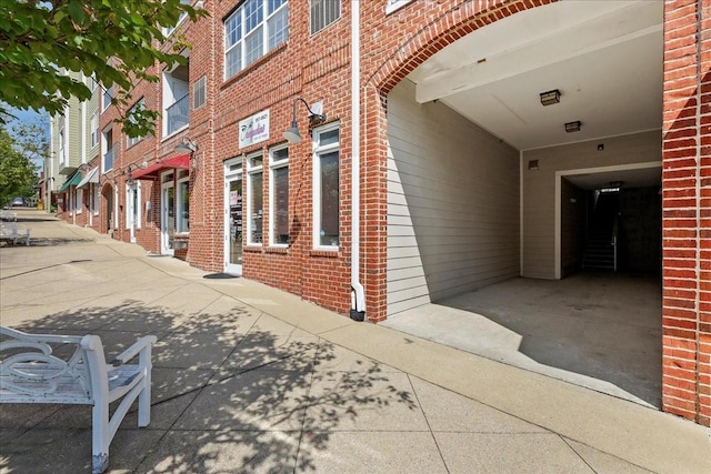 exterior space featuring brick siding