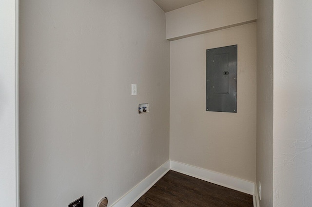 laundry room with hookup for a washing machine, laundry area, baseboards, electric panel, and dark wood finished floors