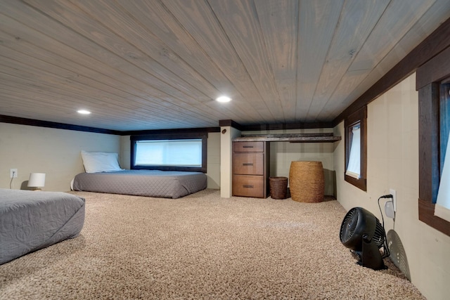 carpeted bedroom with wooden ceiling and recessed lighting