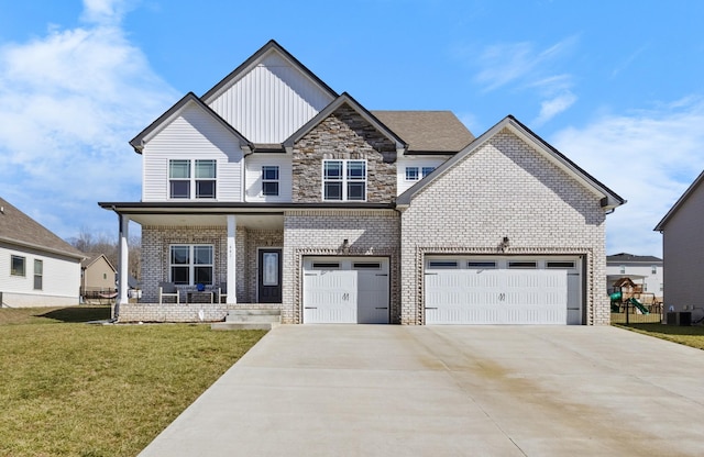 craftsman house with covered porch, brick siding, concrete driveway, board and batten siding, and a front yard