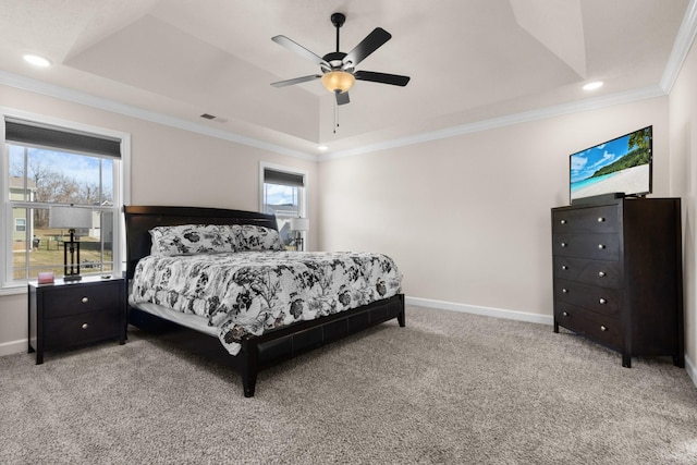 bedroom featuring baseboards, crown molding, a raised ceiling, and light colored carpet