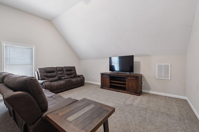 living room featuring visible vents, vaulted ceiling, light carpet, and baseboards