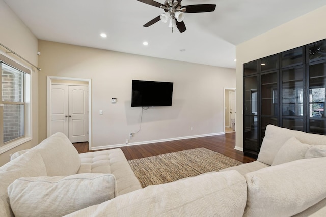 living area with baseboards, ceiling fan, dark wood finished floors, and recessed lighting