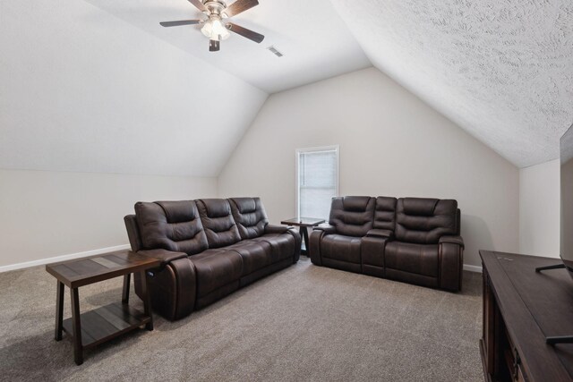 living area featuring light carpet, vaulted ceiling, visible vents, and baseboards