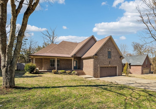 view of front of property with driveway, an attached garage, a front yard, and brick siding