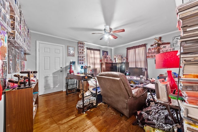 home office featuring wood finished floors, a ceiling fan, and crown molding