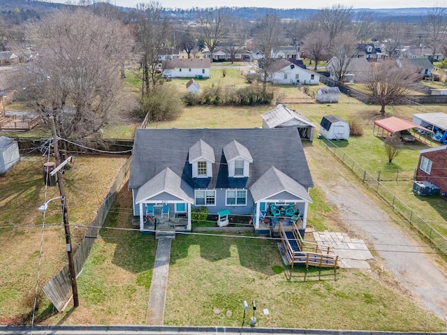 birds eye view of property with a residential view