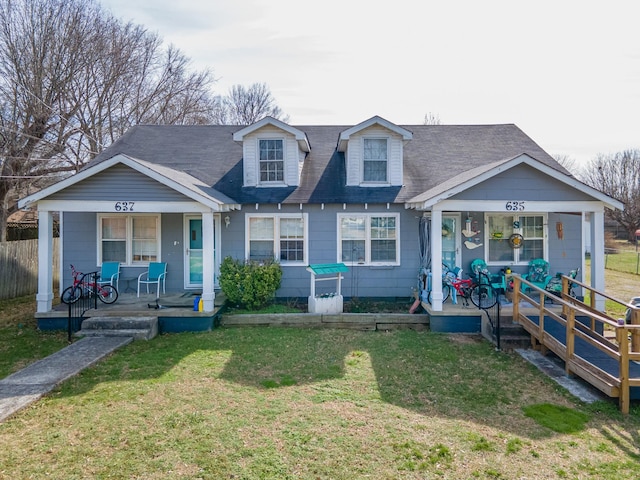 view of front of home with a front yard and covered porch