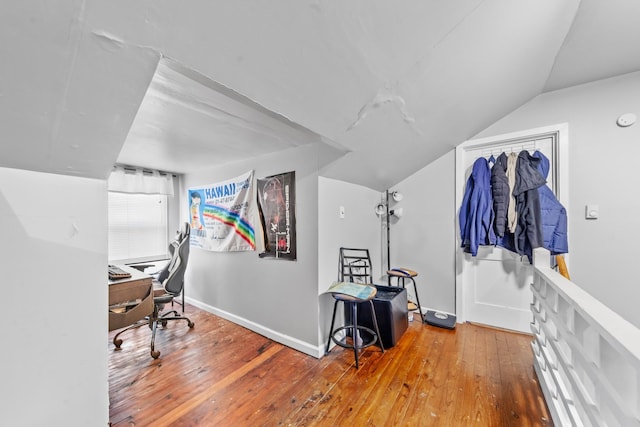 office with vaulted ceiling, wood finished floors, and baseboards