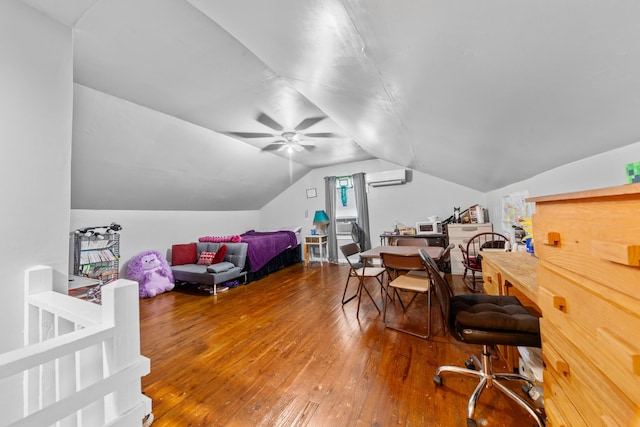 home office featuring vaulted ceiling, a wall mounted air conditioner, and wood finished floors