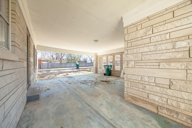 miscellaneous room with unfinished concrete flooring