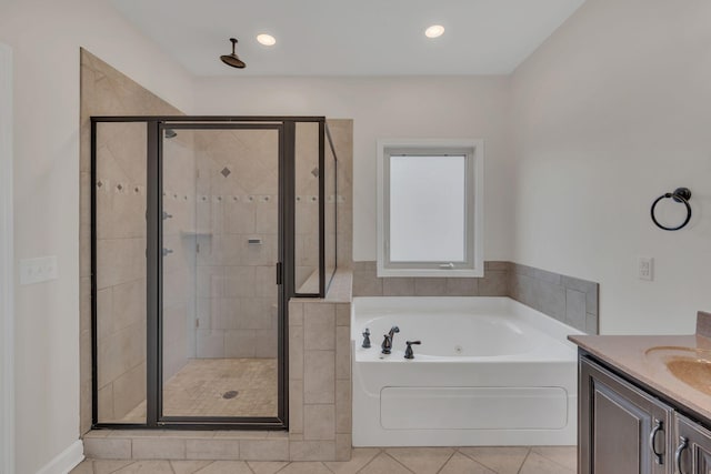 full bathroom featuring a garden tub, recessed lighting, vanity, a shower stall, and tile patterned floors