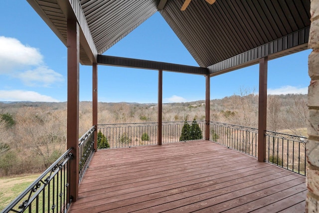 wooden deck with a ceiling fan