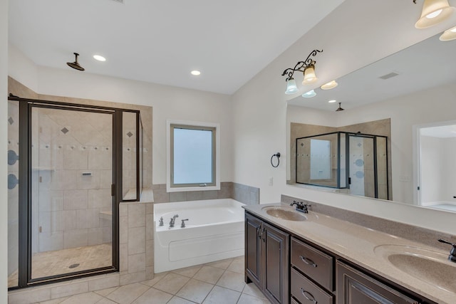 full bath with tile patterned flooring, a garden tub, a sink, and visible vents