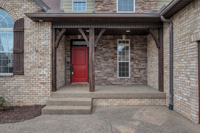 entrance to property with brick siding