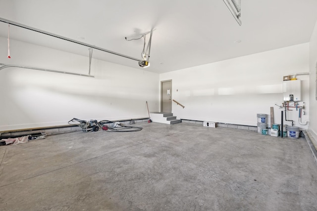 garage with a garage door opener and water heater