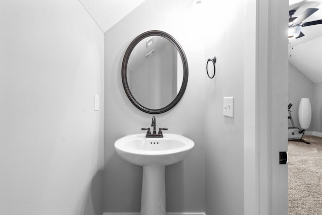 bathroom with lofted ceiling, ceiling fan, and visible vents