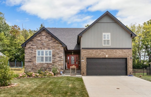 view of front of property with driveway, a front lawn, a trampoline, and fence