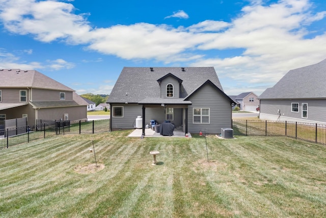 rear view of property with a patio, a lawn, a fenced backyard, and a residential view