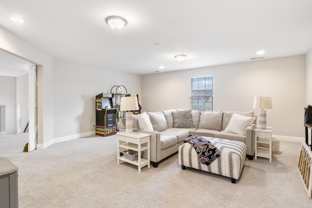 living room featuring recessed lighting, baseboards, visible vents, and light colored carpet